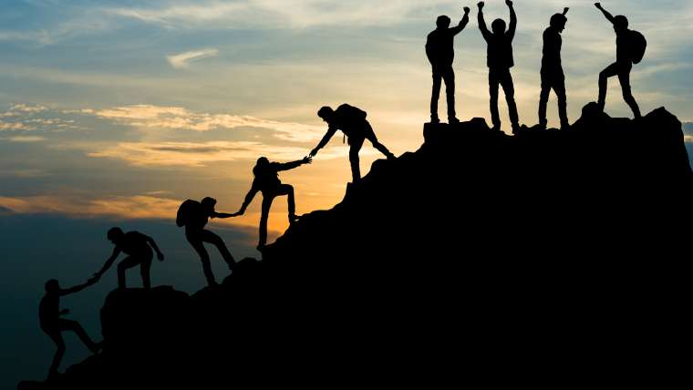Group of people on peak mountain climbing helping team work , travel trekking success business concept