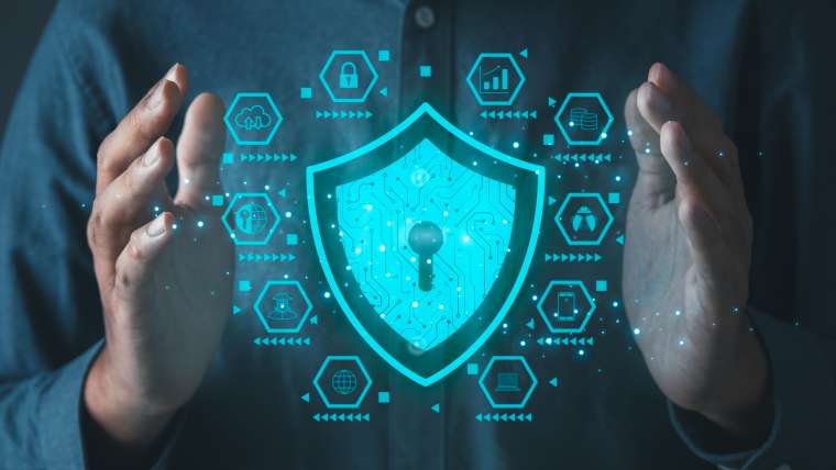 Businessman holding cyber security icons screen. Digital information technology and cyber security concept.