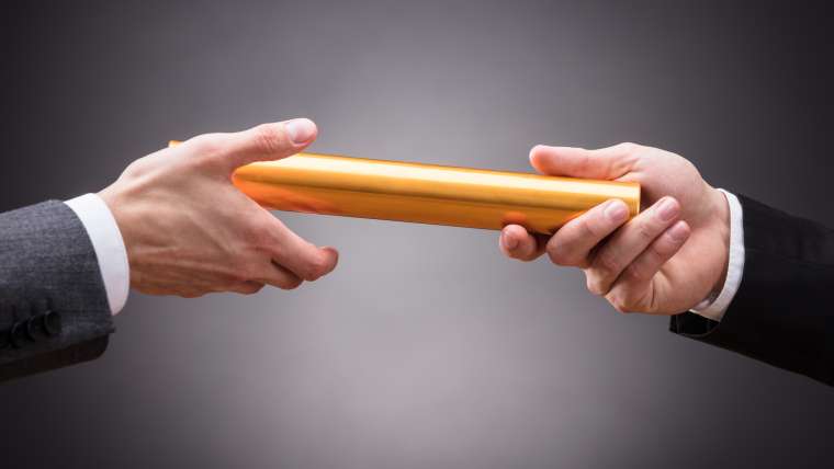 Person Passing Baton To Businessperson